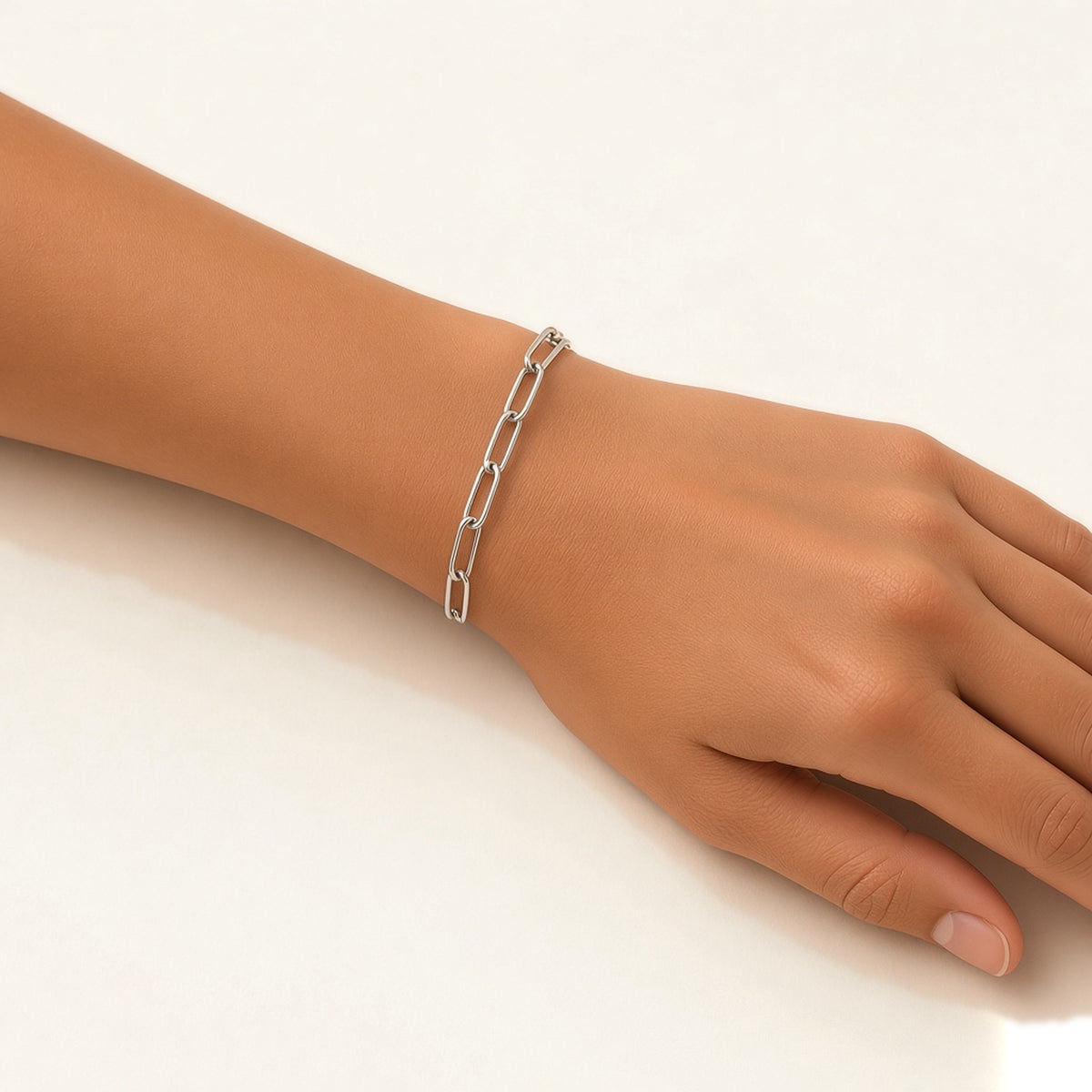 Denoon London paperclip chain bracelet, silver-tone, worn on wrist
