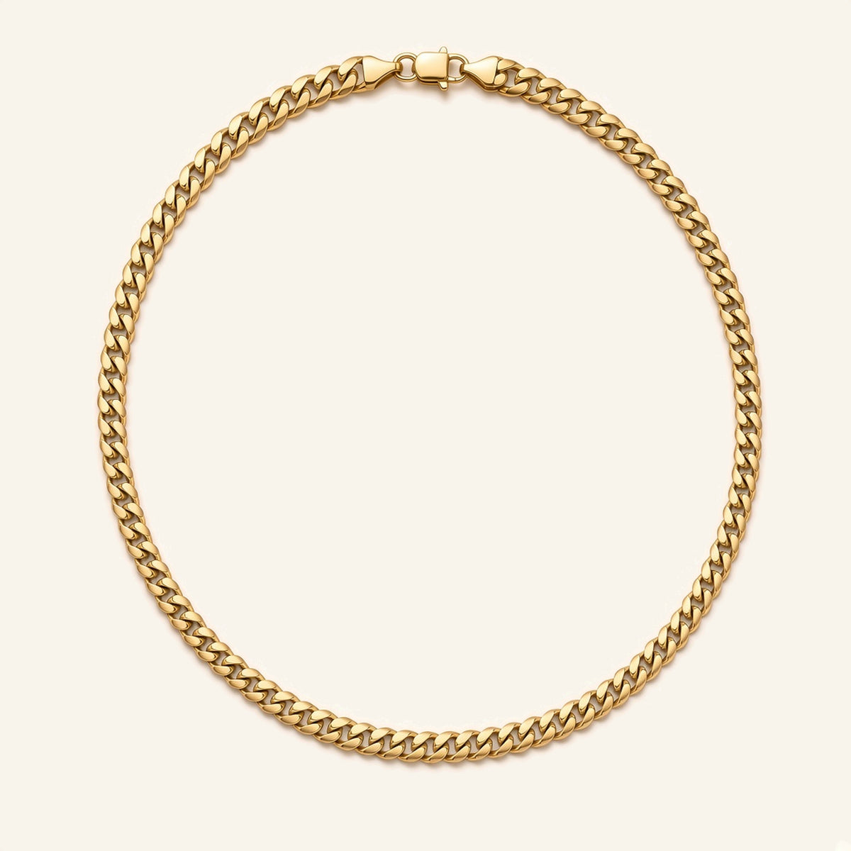 Denoon London gold-tone Cuban link chain necklace 7mm, 55cm, flat lay
