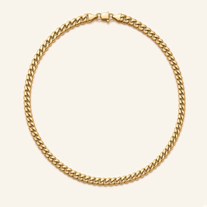 Denoon London gold-tone Cuban link chain necklace 7mm, 55cm, flat lay