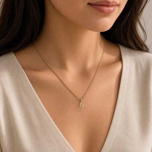 Initial Necklace worn – gold-tone M, 1 cm letter – Denoon London