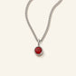 Denoon London Birthstone necklace with crystal birth month pendant in silver-tone, 45cm, flat lay on cream