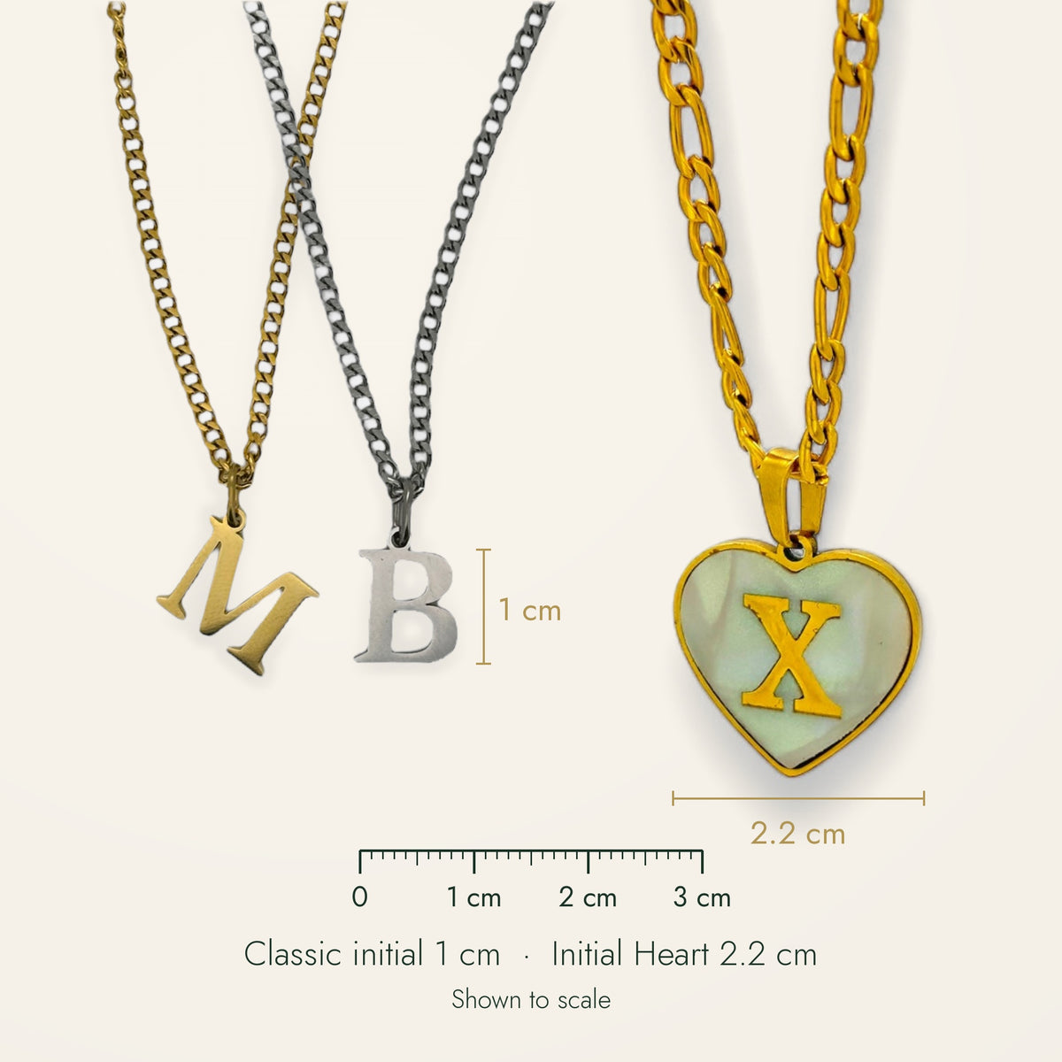 Denoon London Classic Initial 1 cm and Initial Heart 2.2 cm necklaces shown to scale