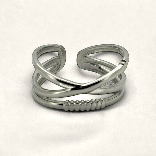 Denoon London crossover statement ring, silver-tone, styled on cream