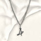 Denoon London cursive initial necklace with heart, silver-tone, letter A shown on cream