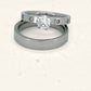 Denoon London engagement ring and wedding band set, silver-tone, on a cream background