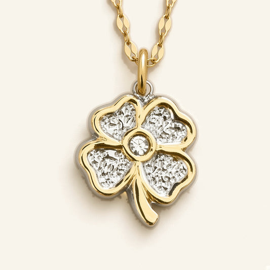Denoon London Four Leaf Heart Clover Necklace, gold-tone: close-up of the clover pendant with gold-tone edges and a centre crystal