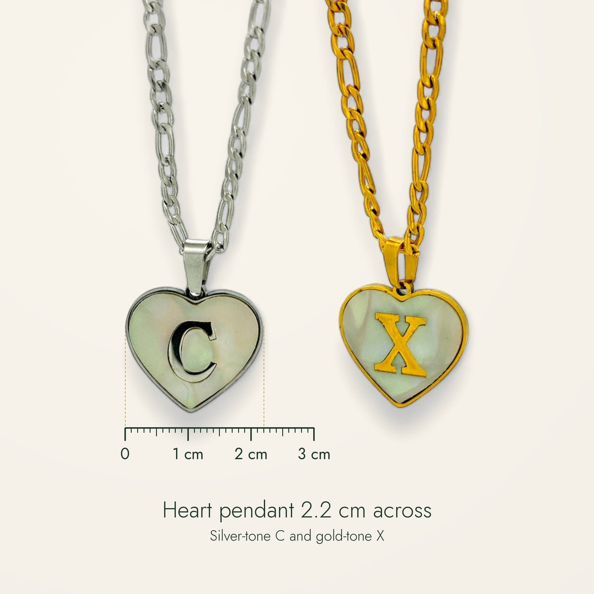 Denoon London Initial Heart necklace pendant shown at 2.2 cm with ruler