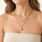 Denoon London layered padlock necklace with heart worn on a model, gold-tone shown