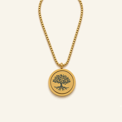 Denoon London Serenity Prayer necklace with Tree of Life spinning pendant in gold-tone, flat lay on cream