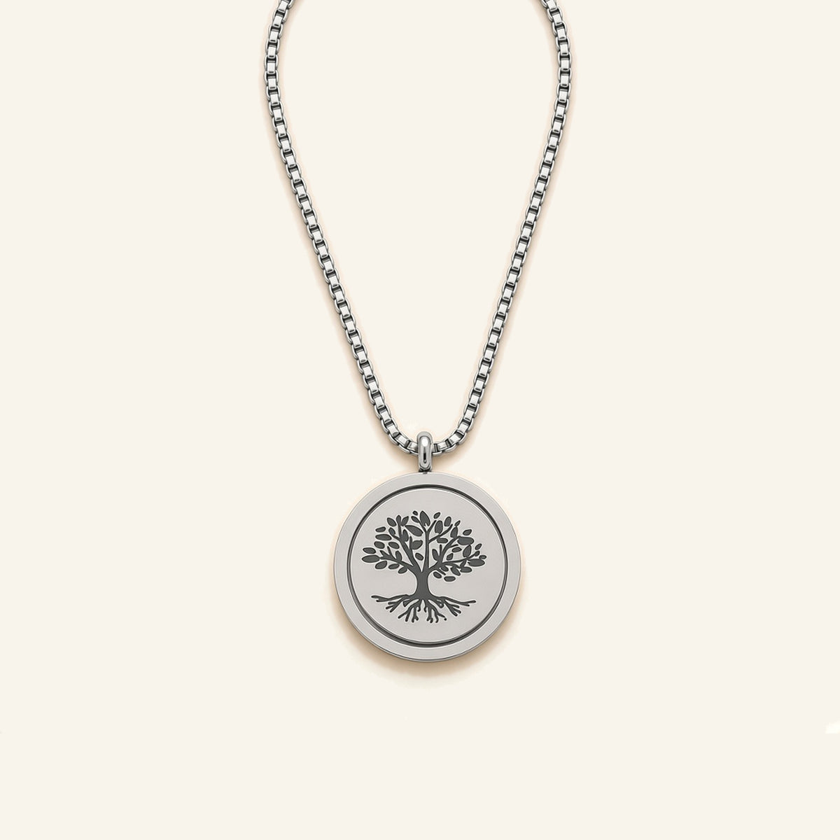 Denoon London Serenity Prayer necklace with Tree of Life spinning pendant in silver-tone, flat lay on cream