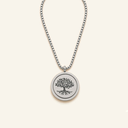 Denoon London Serenity Prayer necklace with Tree of Life spinning pendant in silver-tone, flat lay on cream
