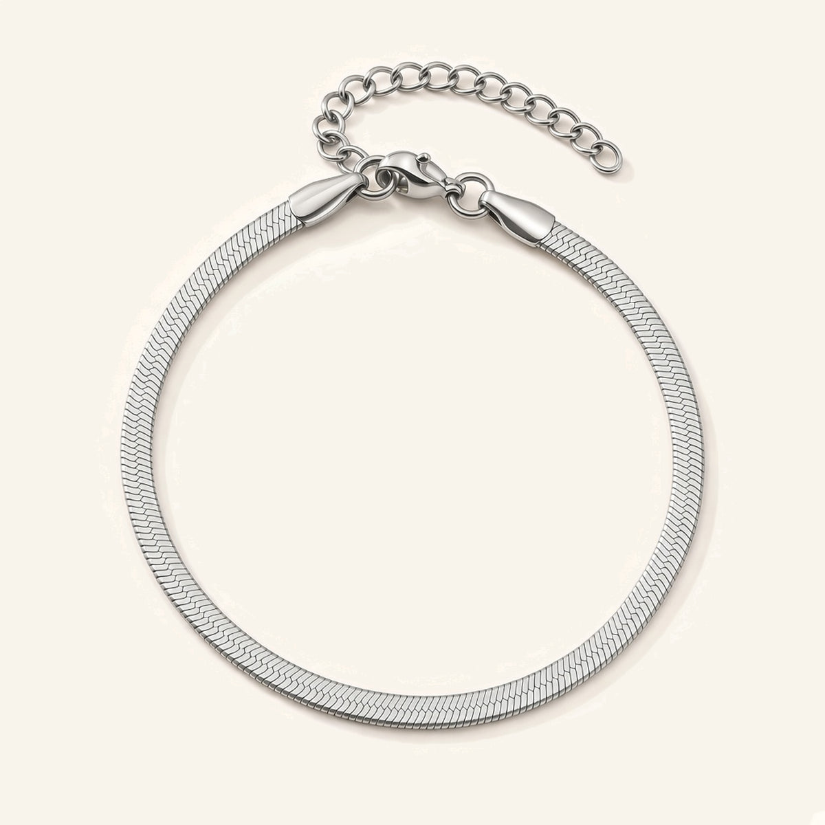 Denoon London silver-tone herringbone snake chain bracelet, flat lay