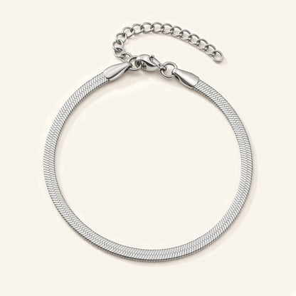 Denoon London silver-tone herringbone snake chain bracelet, flat lay