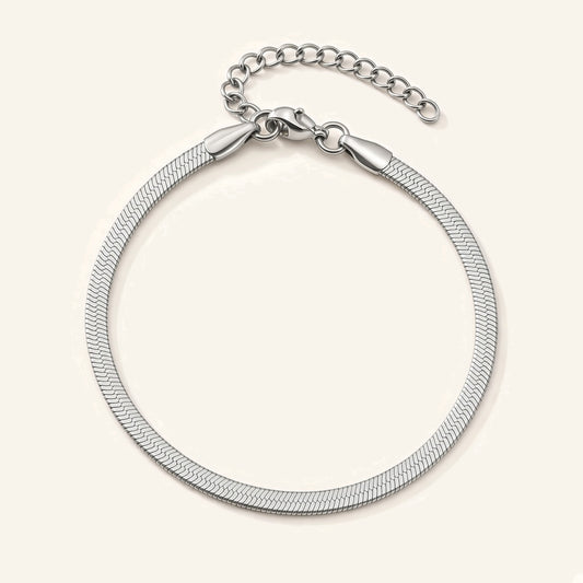 Denoon London silver-tone herringbone snake chain bracelet, flat lay