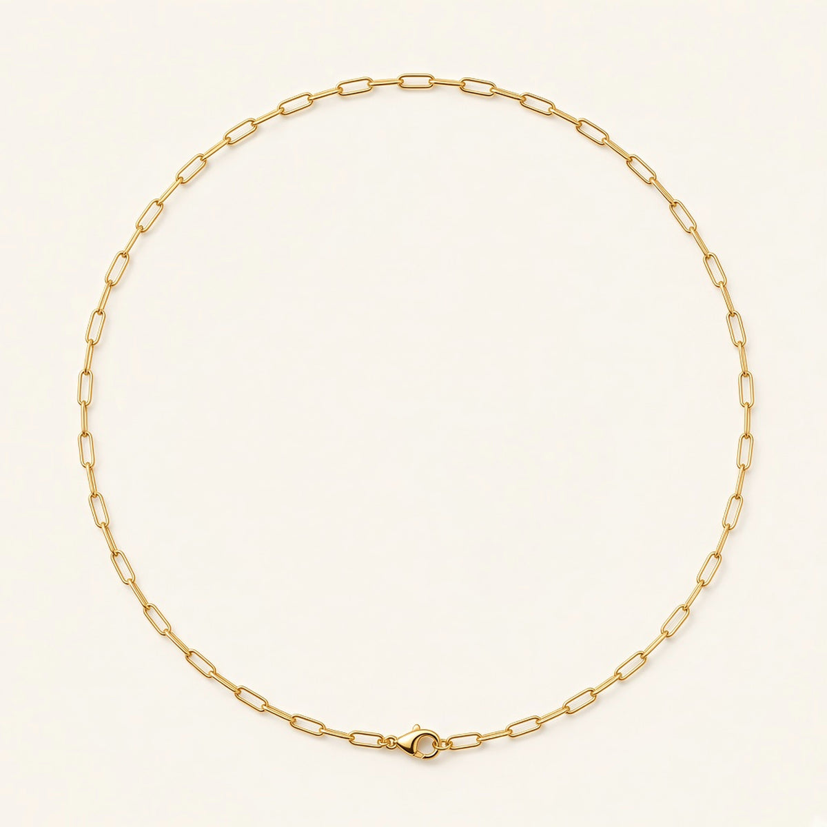 Denoon London paperclip chain necklace, gold-tone, flat lay