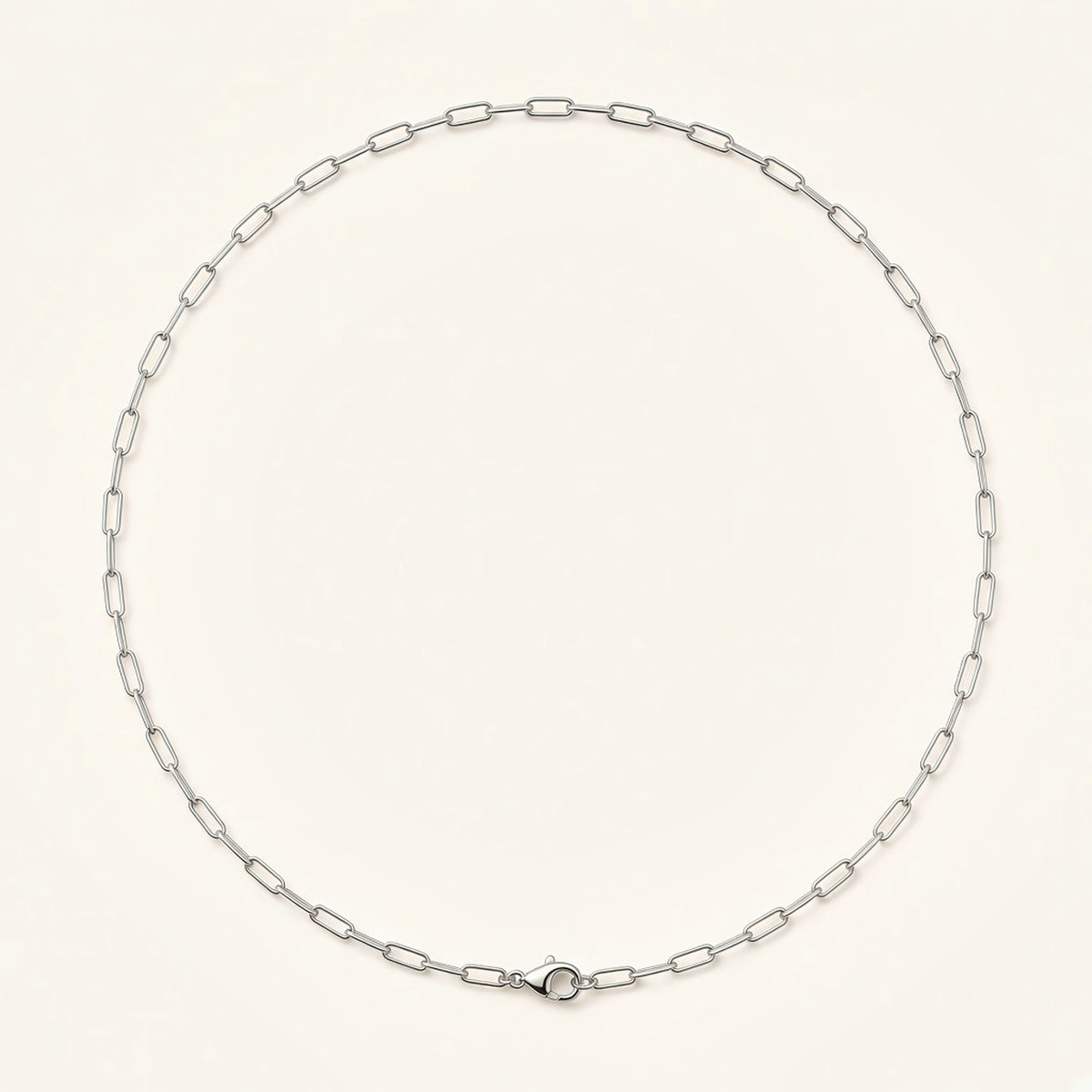 Denoon London paperclip chain necklace, silver-tone, flat lay