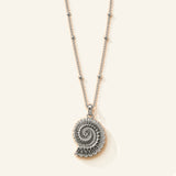 Denoon London shell pendant necklace in silver-tone, flat lay